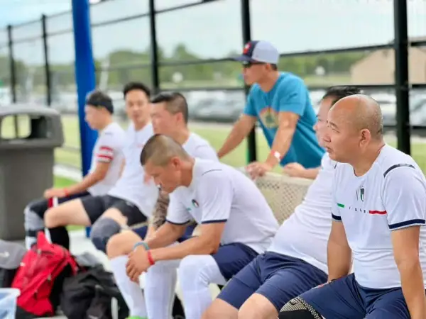 Players resting on the sideline bench